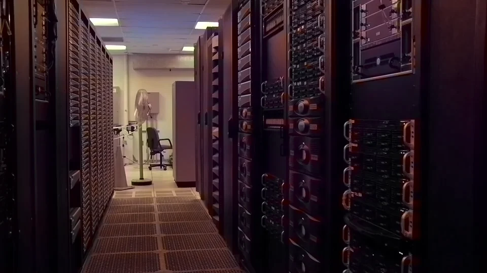 Server racks in a data center, where simulations run step after step.