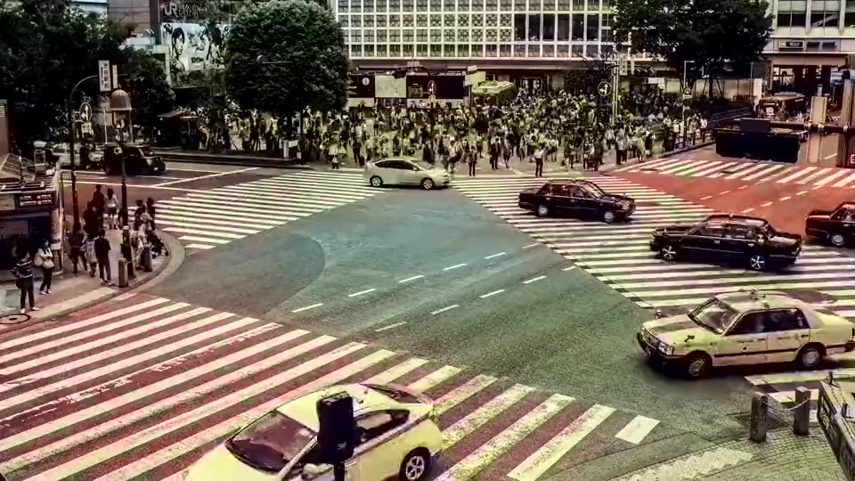 A fixed camera view of a road junction, where most of each frame repeats.